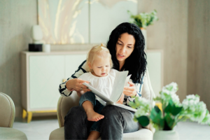 A mother reads to her toddler