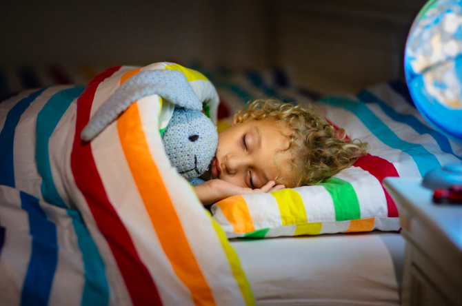 A child wears orthokeratology contact lenses while he sleeps