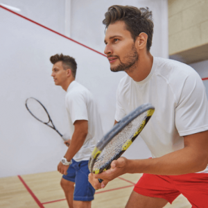 Two men play squash